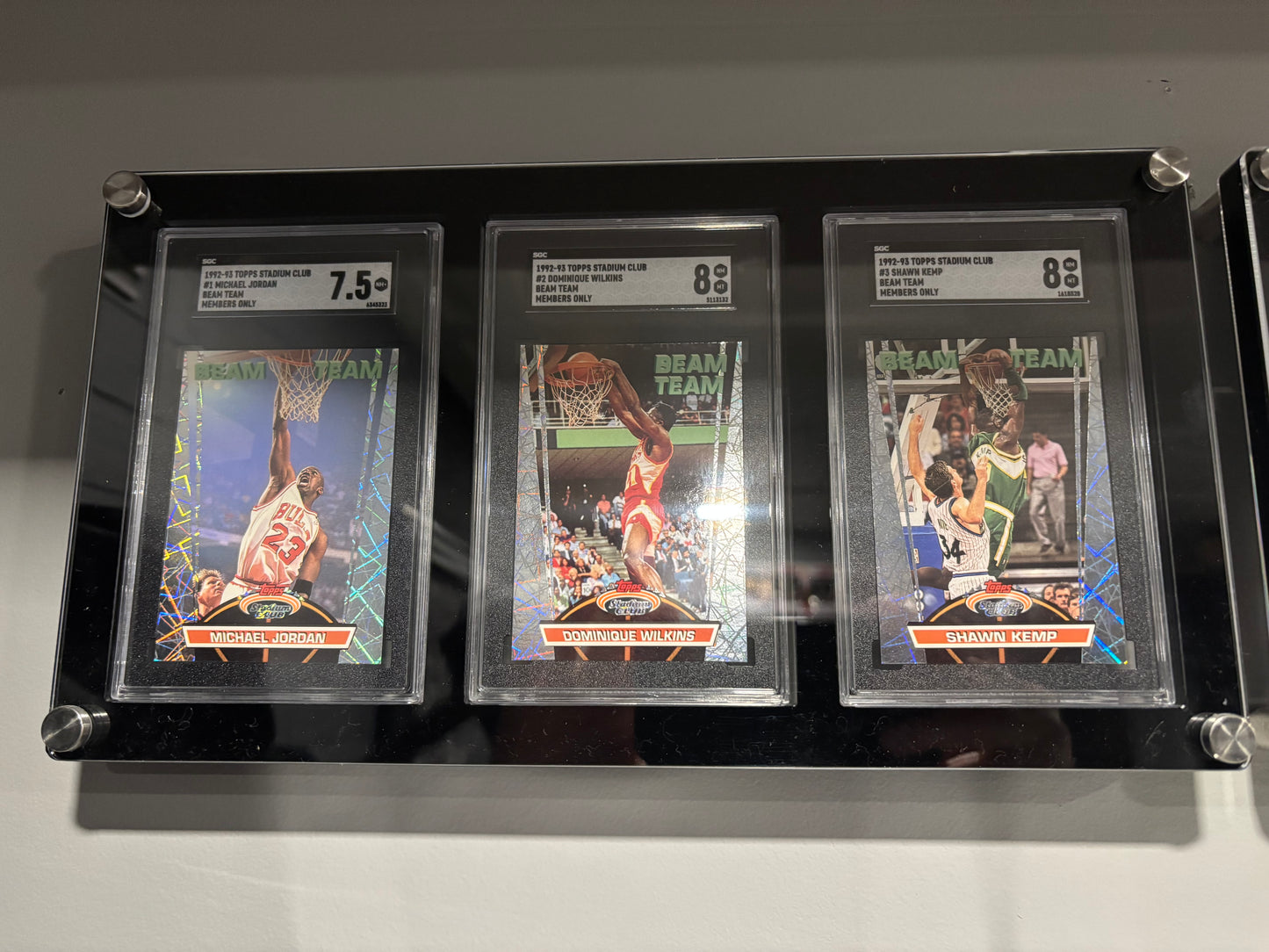 Items included
92/93 members only tops stadium club complete set with beam team graded by SGC

1987 NBA fleer sticker set grated PSA 8

1988 NBA fleer binder set with three Jordans included